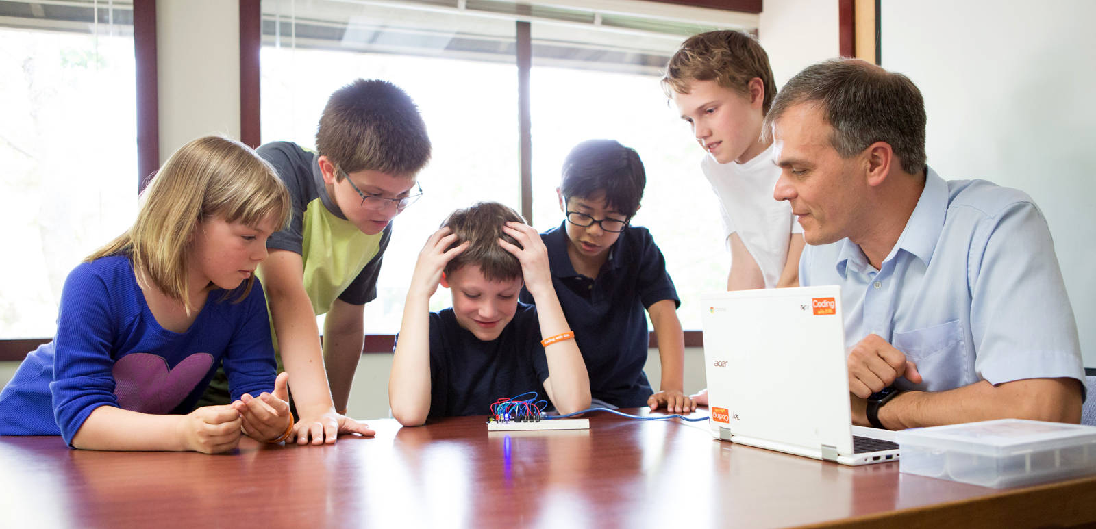 Students programming in a Coding with Kids Premium Center Class